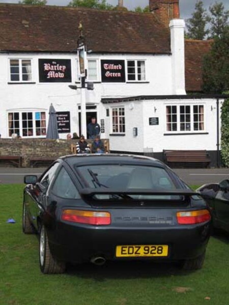 Porsche 928 parked on the green at the Barley Mow
