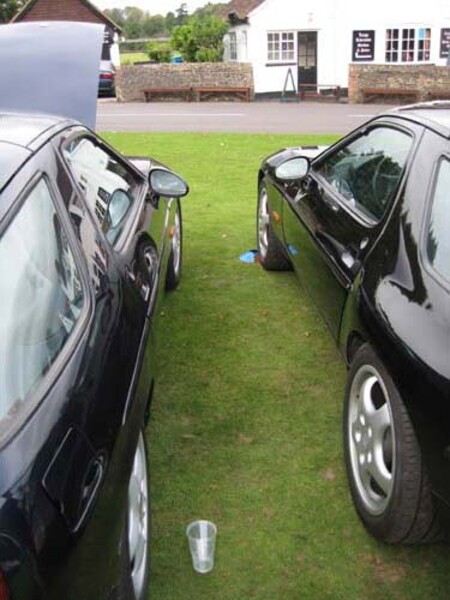 Porsche 928 parked on the green at the Barley Mow