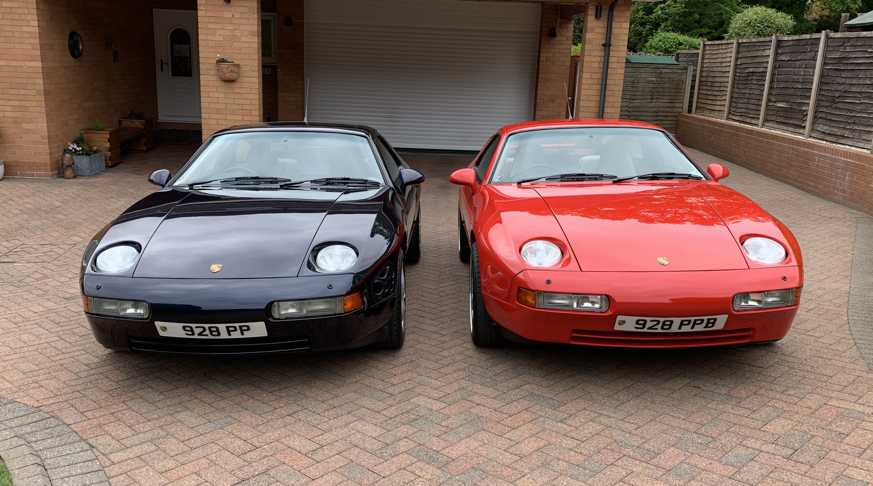 1991 guards red 928 GT and a 1994 midnight blue 928 GTS
